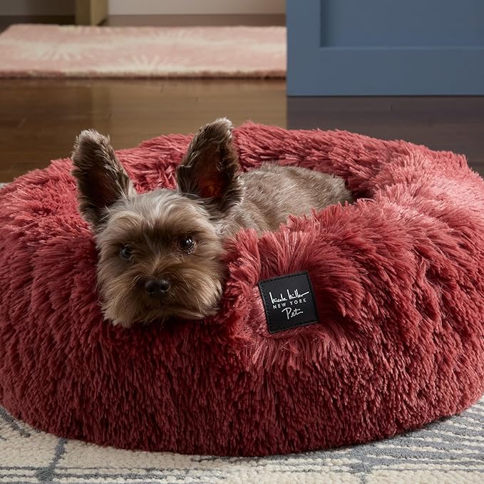 Nicole Miller New York PET Ellie Fuzzy Solid Donut Pet Bed, Plush, Cozy & Calming, Non-Slip Bottom, 100% Machine Washable, Burgundy Rose, X-Small 19"x19"x7" Round